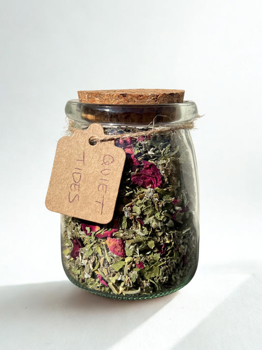 quiet tides herbal tea in glass jar — a balancing blend with raspberry leaf and nettle to promote light flow and calm the womb
